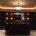 Chandelier and puck lighting installation for home bar in La Jolla